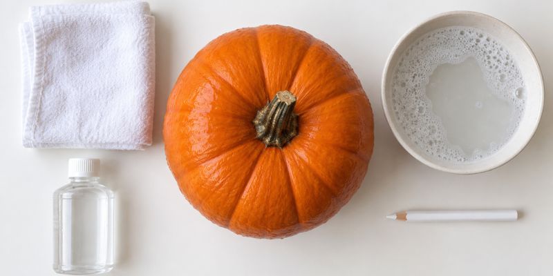 Pumpkin prep supplies including rubbing alcohol and a cloth